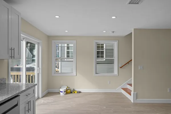 a bedroom with furniture and window