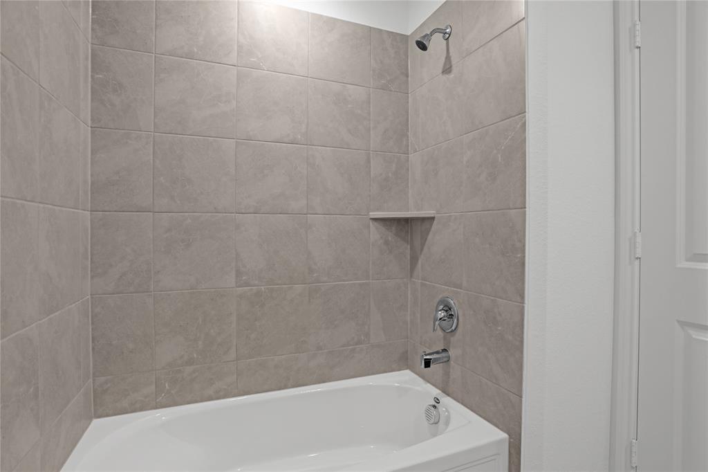 14048 Earlham Street Pilot Point, TX 76258 - Photo 12 of 15 a bathroom with a bathtub