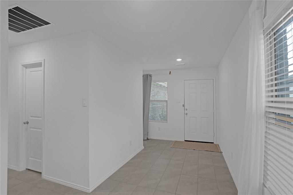 14048 Earlham Street Pilot Point, TX 76258 - Photo 5 of 15 an empty room with windows and closet