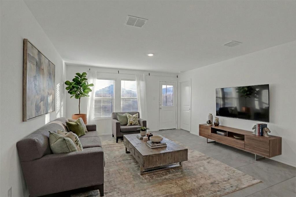 14048 Earlham Street Pilot Point, TX 76258 - Photo 6 of 15 a living room with furniture and a flat screen tv