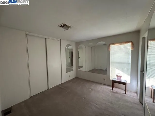 a bathroom with a shower and toilet