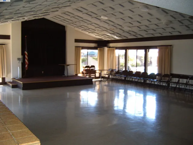 a view of a living room with hardwood floor