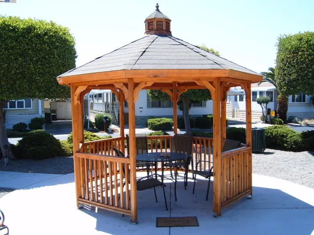 a living room with furniture and large windows