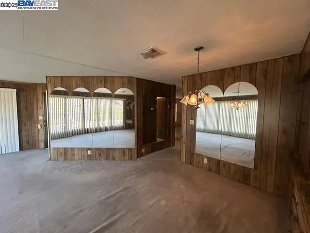 a large room with a large window and chandelier