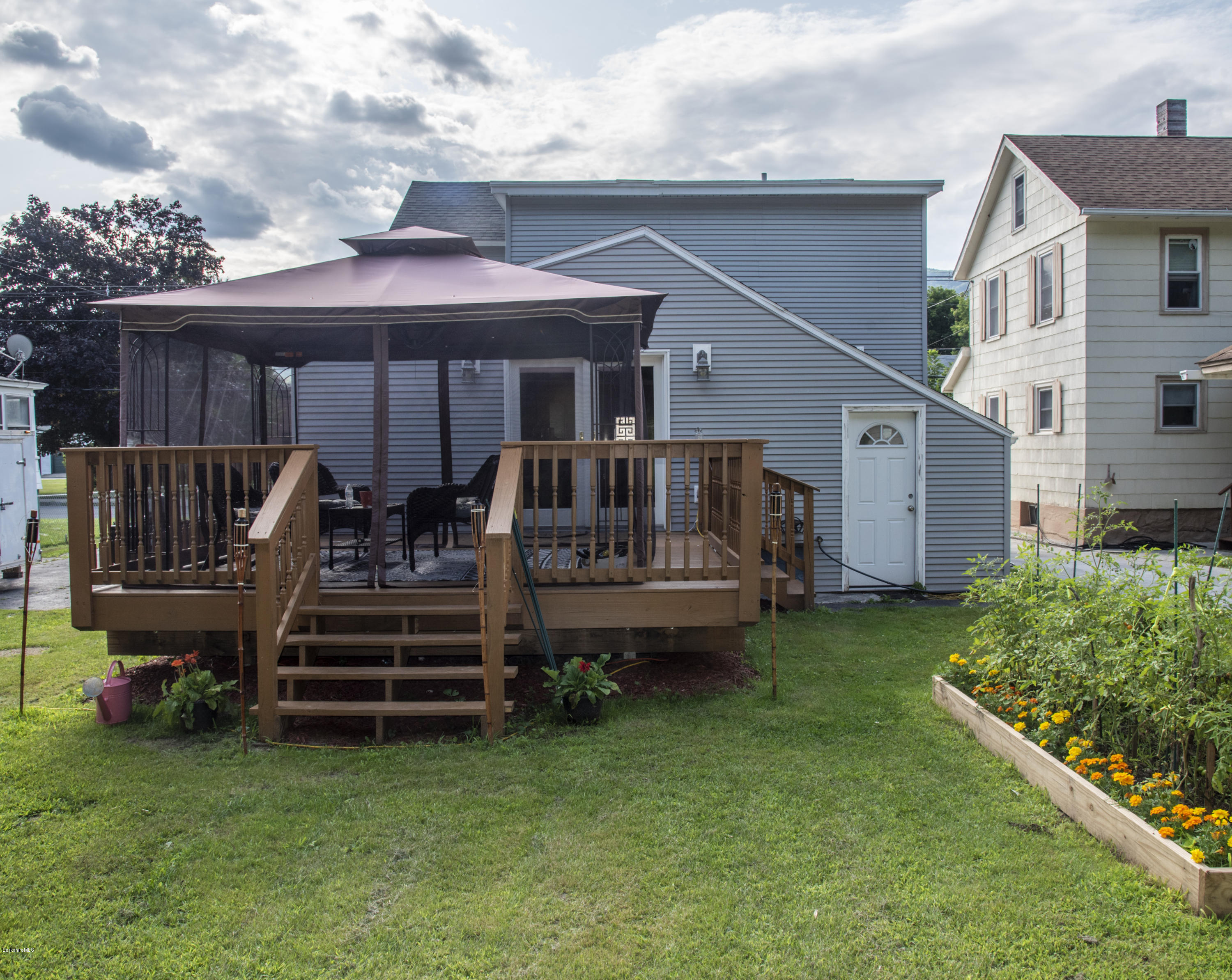 97 North Summer Street Adams, MA 01220 - Photo 17 of 17 a view of a house with a yard and furniture
