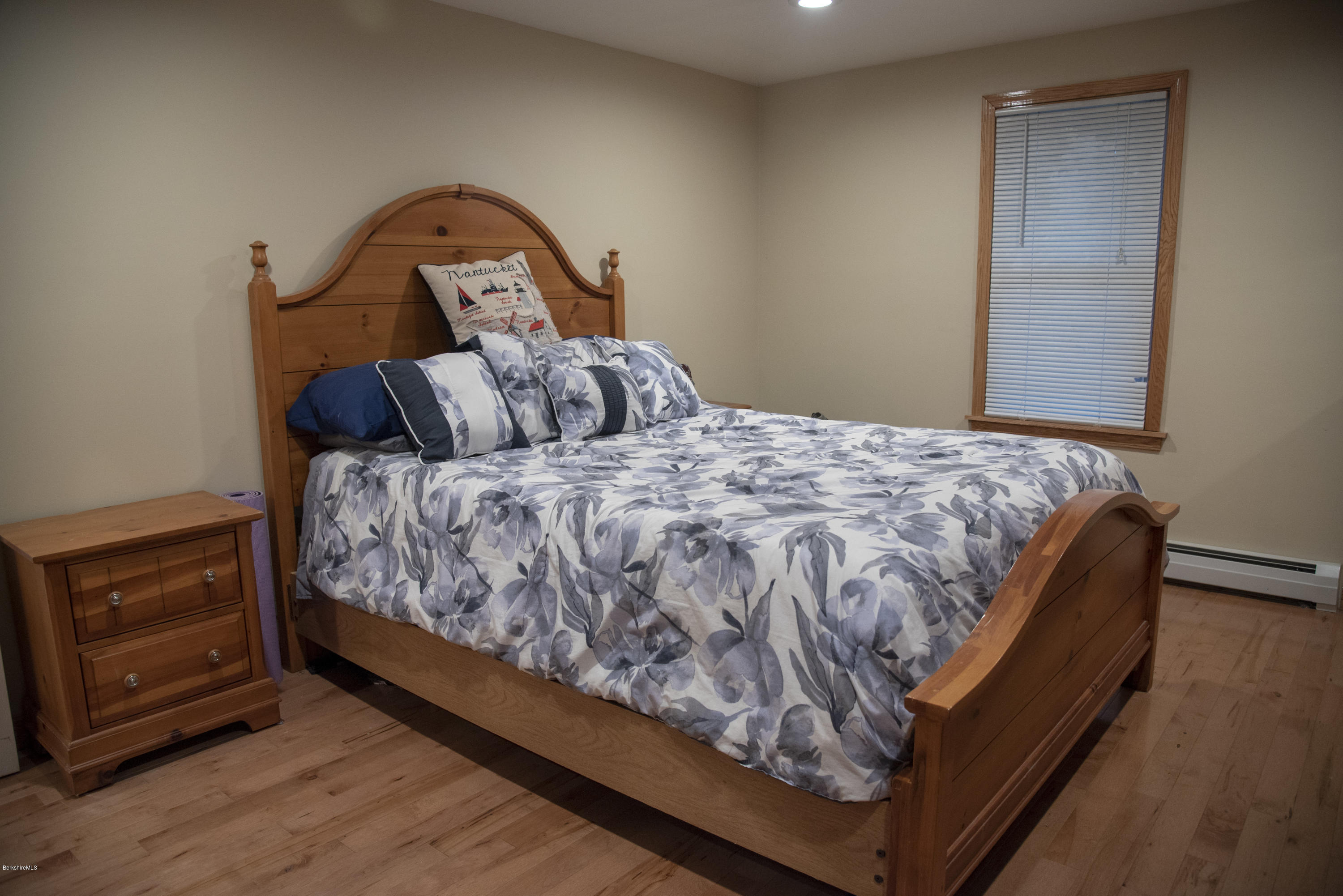 97 North Summer Street Adams, MA 01220 - Photo 10 of 17 a bed sitting in a bedroom next to a window