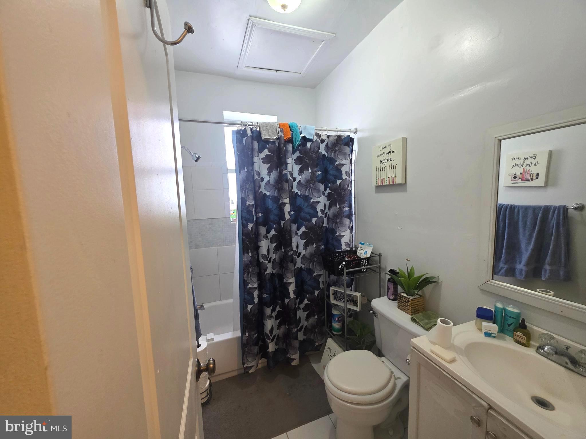 2730 East Chase Street Baltimore, MD 21213 - Photo 11 of 17 a bathroom with a sink toilet and shower