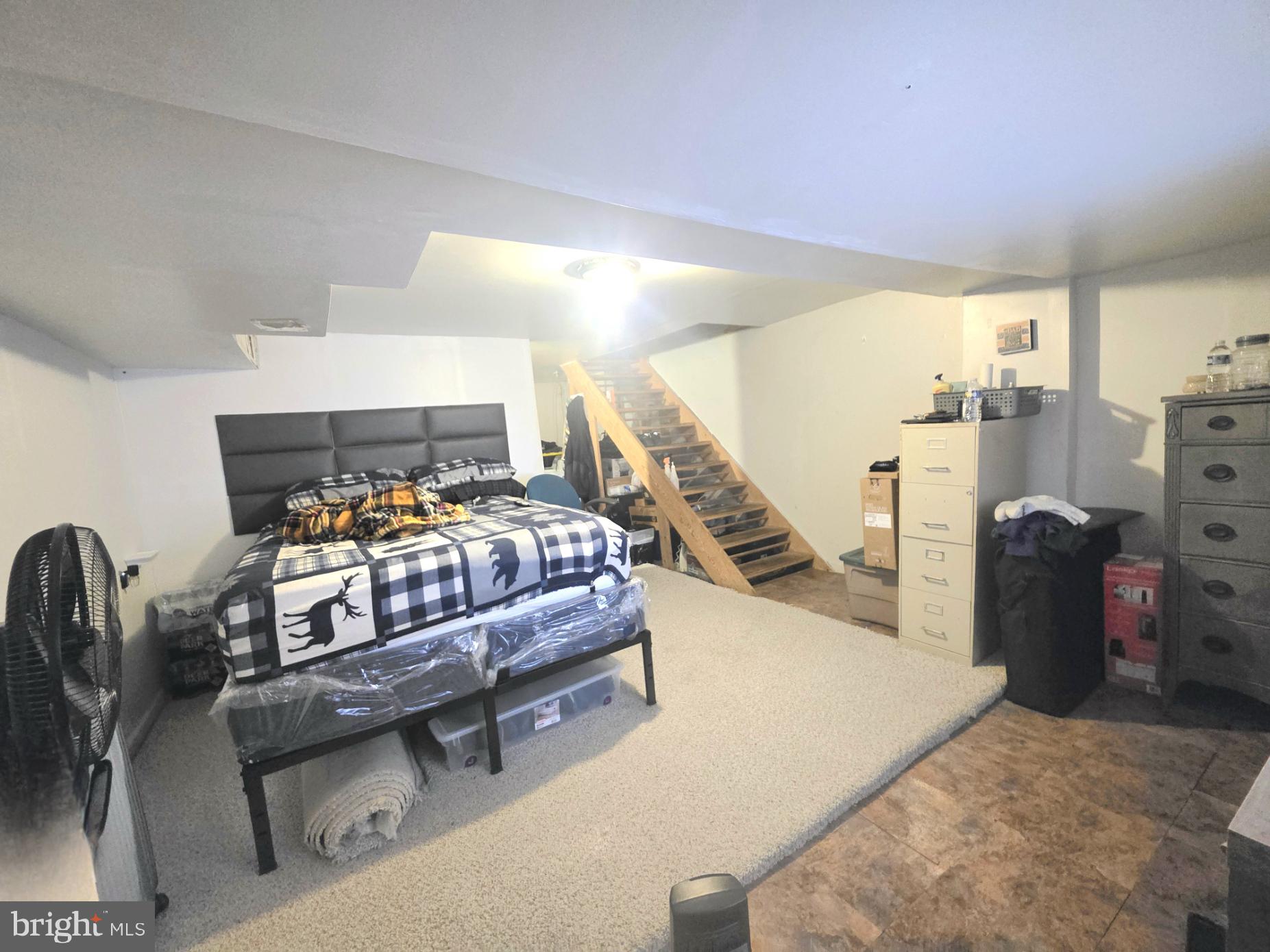 2730 East Chase Street Baltimore, MD 21213 - Photo 12 of 17 a bedroom with furniture and a wooden floor