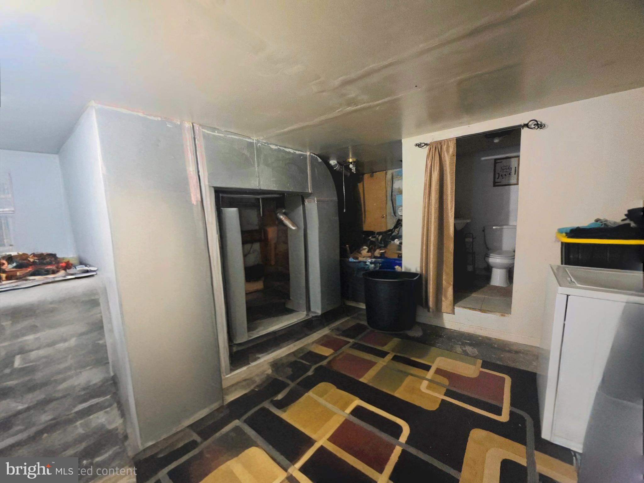 2730 East Chase Street Baltimore, MD 21213 - Photo 14 of 17 a living room with furniture