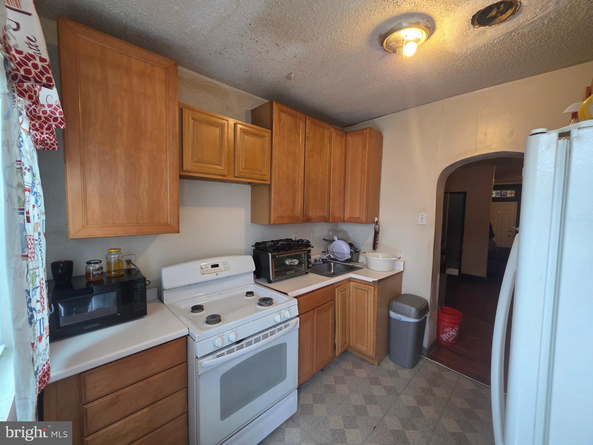 2730 East Chase Street Baltimore, MD 21213 - Photo 5 of 17 a view of a kitchen with sink and cabinets