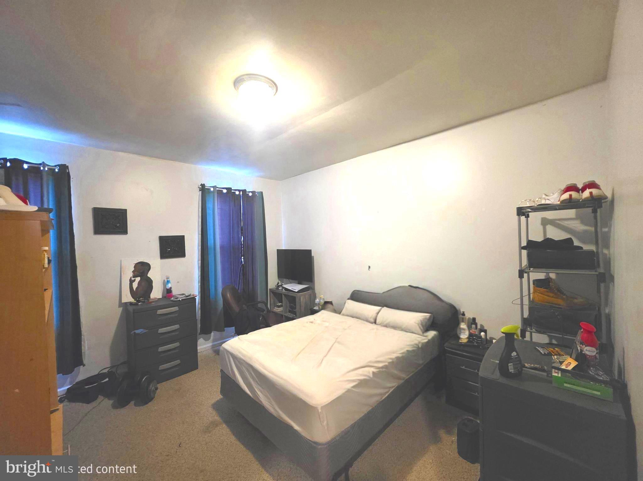 2730 East Chase Street Baltimore, MD 21213 - Photo 8 of 17 a bathroom with a sink and a mirror