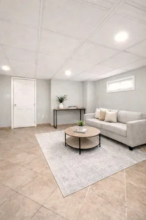 a living room with furniture and a table