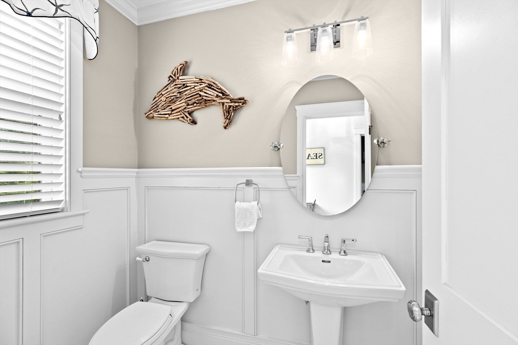 170 Otis Street Hingham, MA 02043 - Photo 14 of 42 a bathroom with a toilet sink and mirror