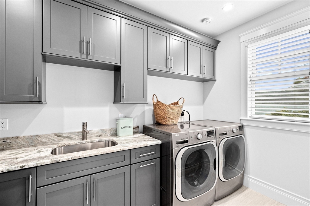 170 Otis Street Hingham, MA 02043 - Photo 15 of 42 a utility room with sink dryer and washer