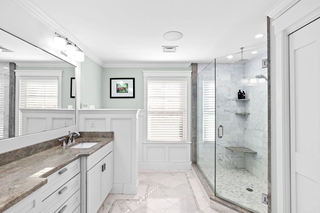 170 Otis Street Hingham, MA 02043 - Photo 23 of 42 a bathroom with a granite countertop sink mirror and double