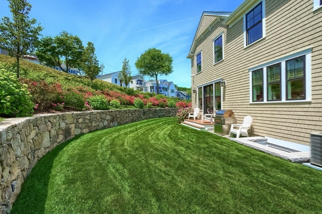 170 Otis Street Hingham, MA 02043 - Photo 36 of 42 a view of a house with backyard sitting area and garden