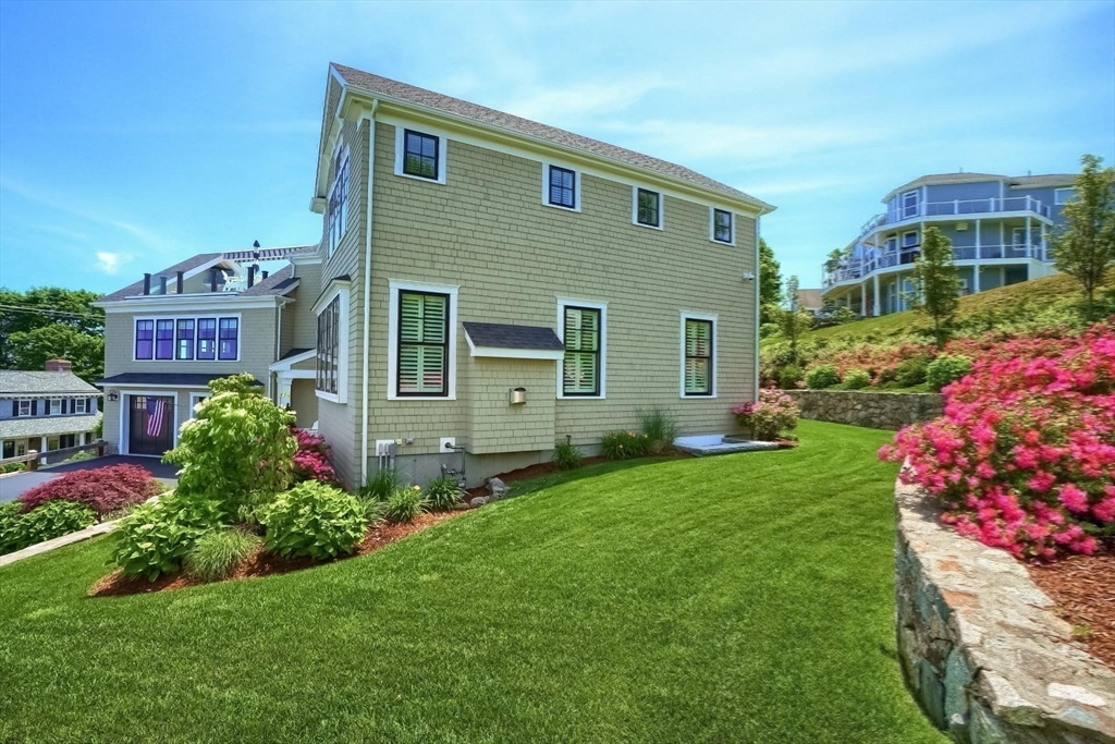 170 Otis Street Hingham, MA 02043 - Photo 41 of 42 a front view of a house with a yard and outdoor seating