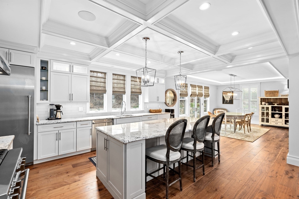 170 Otis Street Hingham, MA 02043 - Photo 9 of 42 a large kitchen with a table and chairs