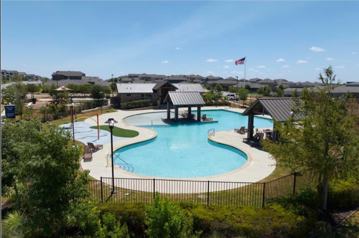 10805 Meris Lane Austin, TX 78754 - Photo 26 of 28 An inviting community pool with shaded cabanas and nearby playground offers year-round recreation.