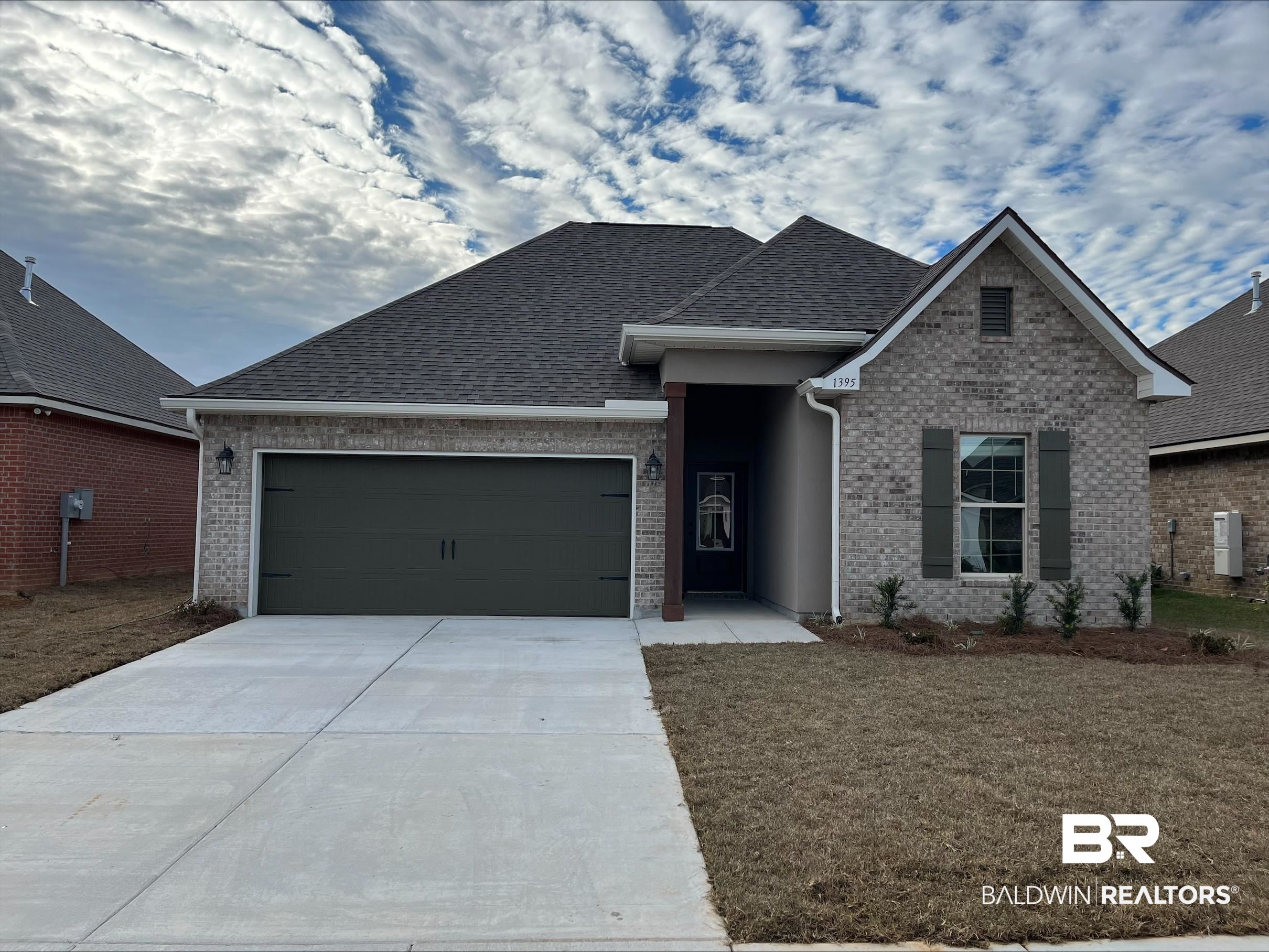 1395 Fenton Circle Foley, AL 36535 - Photo 1 of 3 View of front of home with a front yard and a garage