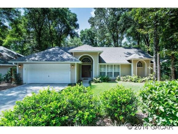 9925 Southwest 41 Road Gainesville, FL 32608 - Photo 1 of 1 a front view of a house with garden