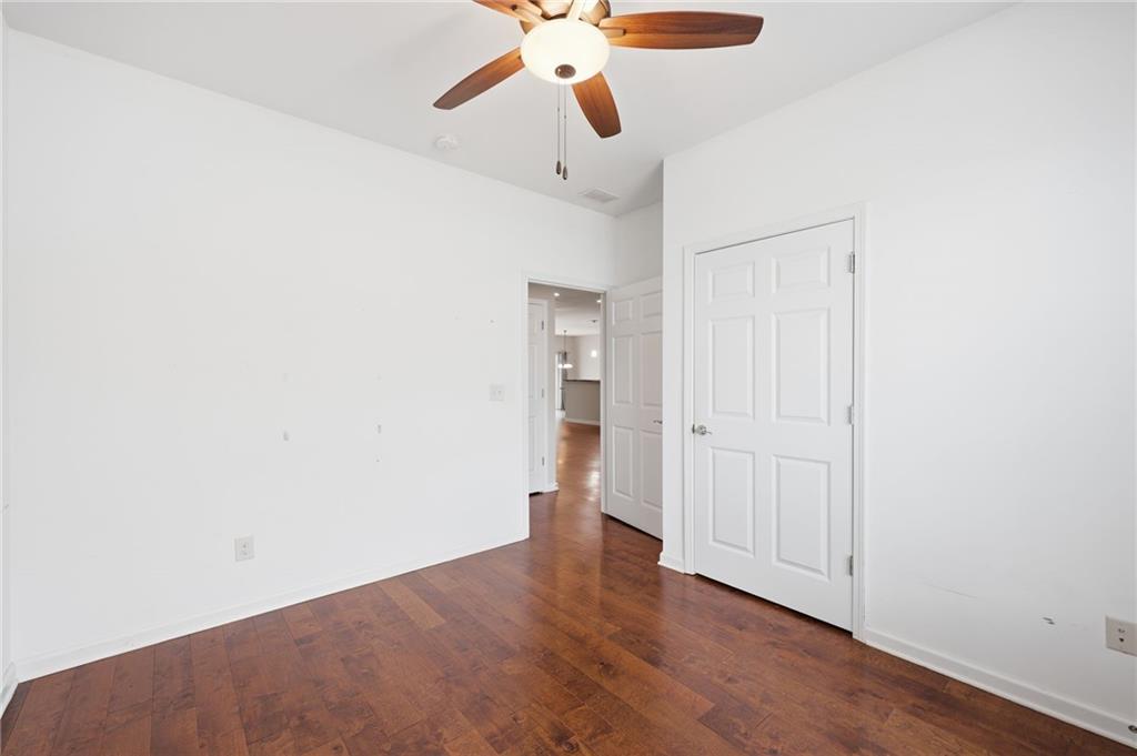 166 Senior Circle Northeast Gainesville, GA 30501 - Photo 23 of 32 a view of an empty room with wooden floor