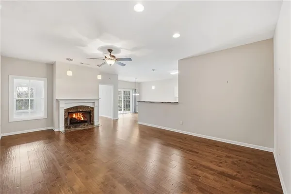 wooden floor in a hall with an empty room