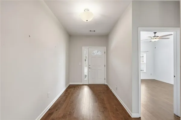 a view of a kitchen with a sink and a window