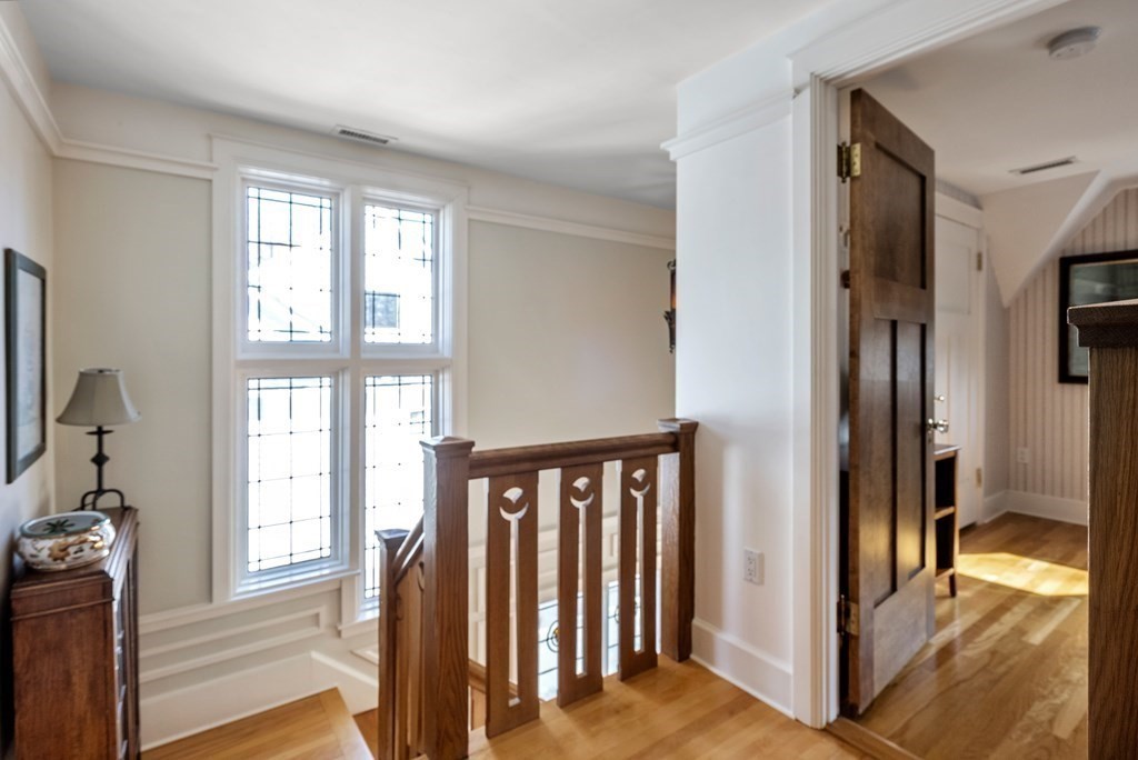 165 Fair Oaks Park Needham, MA 02492 - Photo 14 of 28 a view of a hallway with windows and stairs