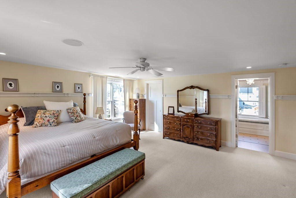 165 Fair Oaks Park Needham, MA 02492 - Photo 15 of 28 a bedroom with a large bed and a dresser