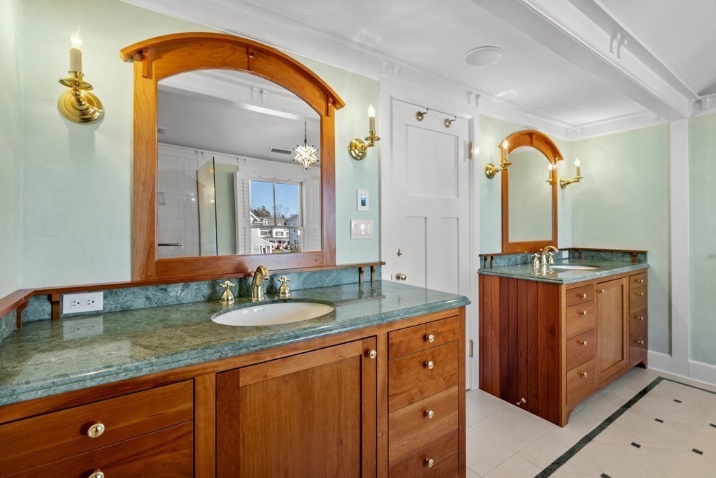165 Fair Oaks Park Needham, MA 02492 - Photo 16 of 28 a bathroom with a granite countertop sink and a mirror
