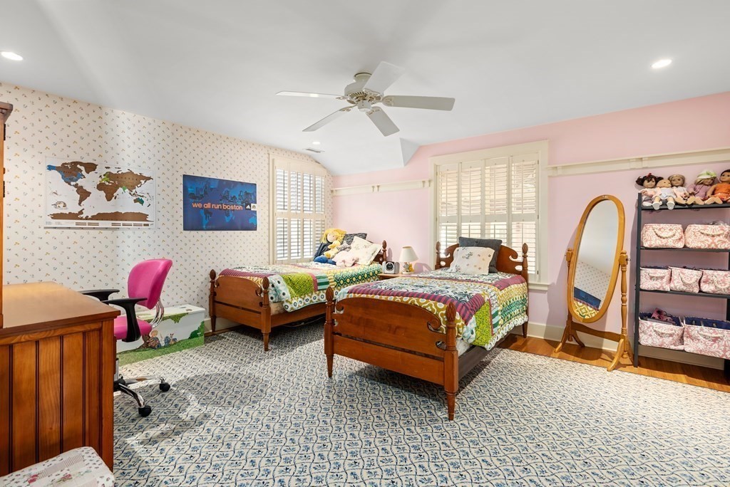 165 Fair Oaks Park Needham, MA 02492 - Photo 18 of 28 a bedroom with a bed and a chandelier