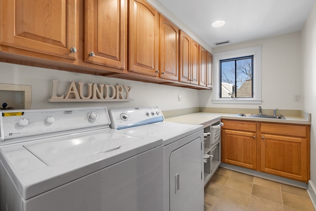 165 Fair Oaks Park Needham, MA 02492 - Photo 20 of 28 a kitchen with stainless steel appliances granite countertop a sink and cabinets