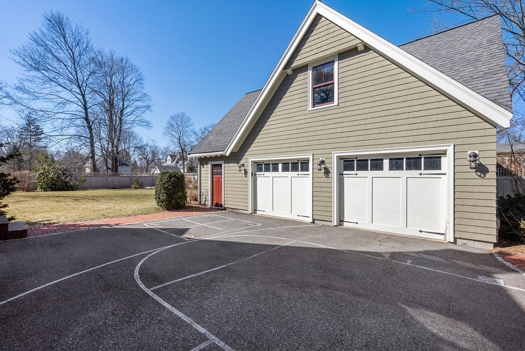 165 Fair Oaks Park Needham, MA 02492 - Photo 26 of 28 a view of a house with a yard and garage