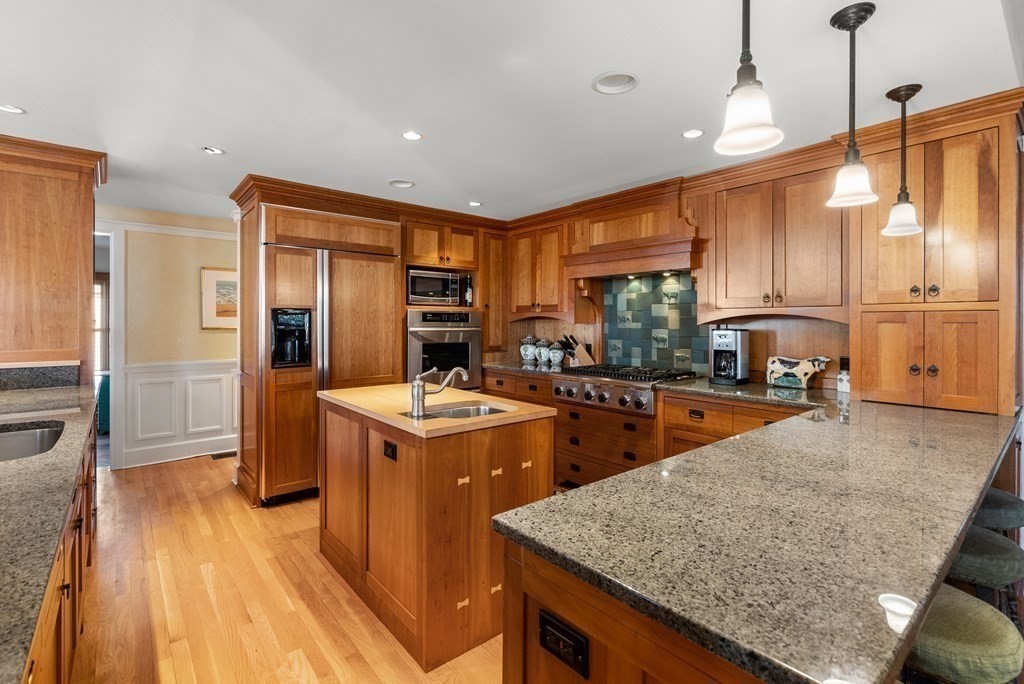 165 Fair Oaks Park Needham, MA 02492 - Photo 8 of 28 a kitchen that has a lot of cabinets in it