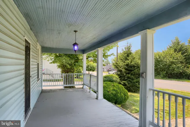 a front view of a house with a porch