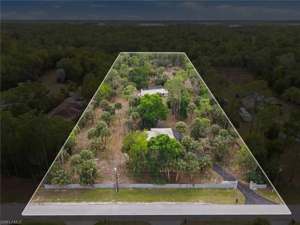 a view of a swimming pool with a yard