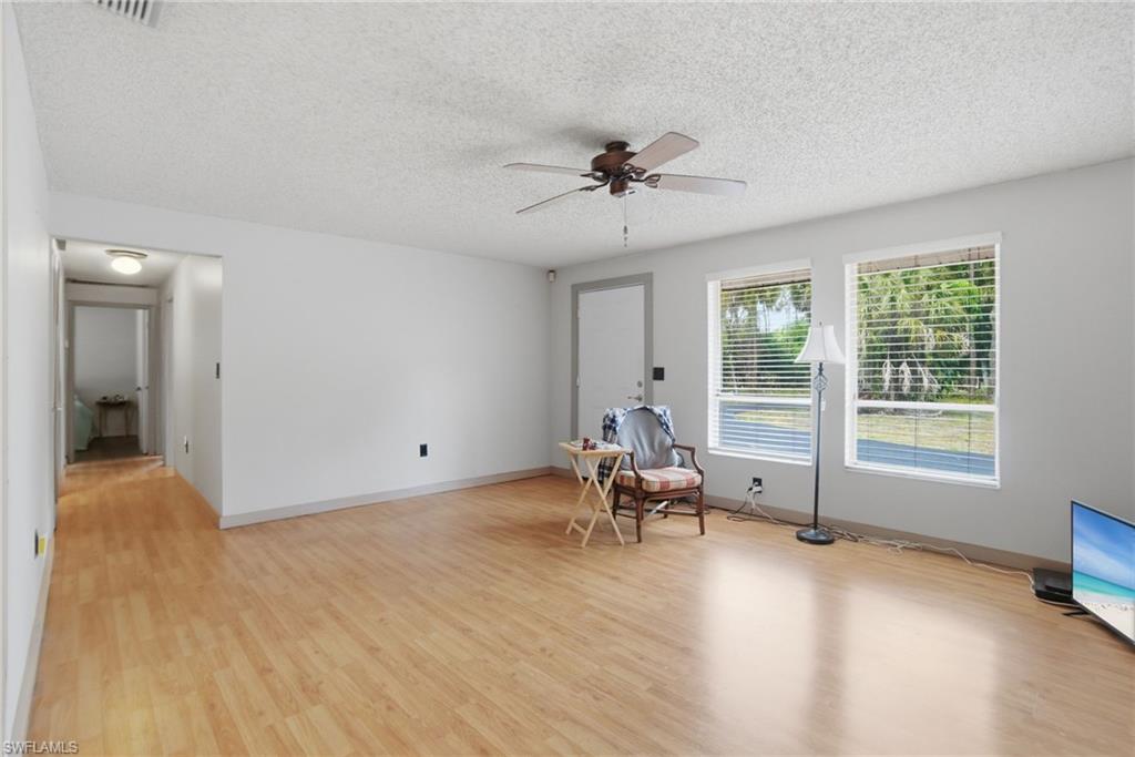 3670 27th Avenue Southwest Naples, FL 34117 - Photo 11 of 38 a view of a livingroom with workspace and a window