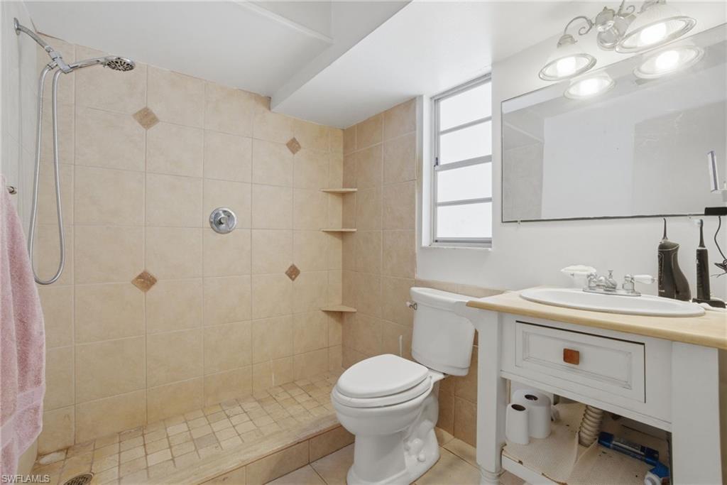 3670 27th Avenue Southwest Naples, FL 34117 - Photo 20 of 38 a bathroom with a sink a toilet and shower