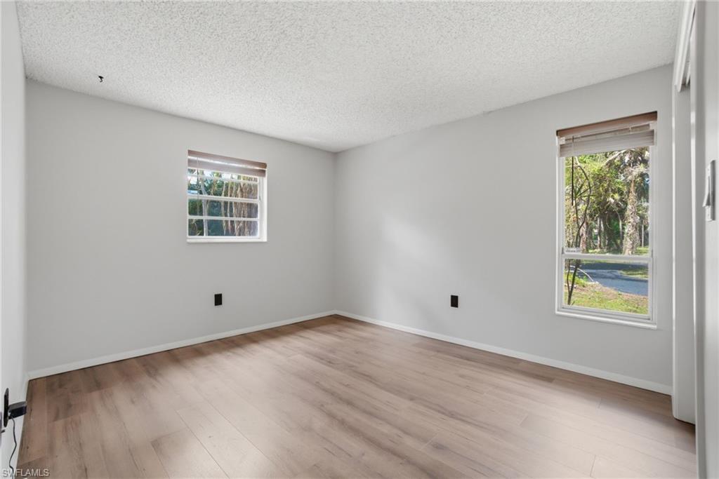 3670 27th Avenue Southwest Naples, FL 34117 - Photo 21 of 38 an empty room with windows