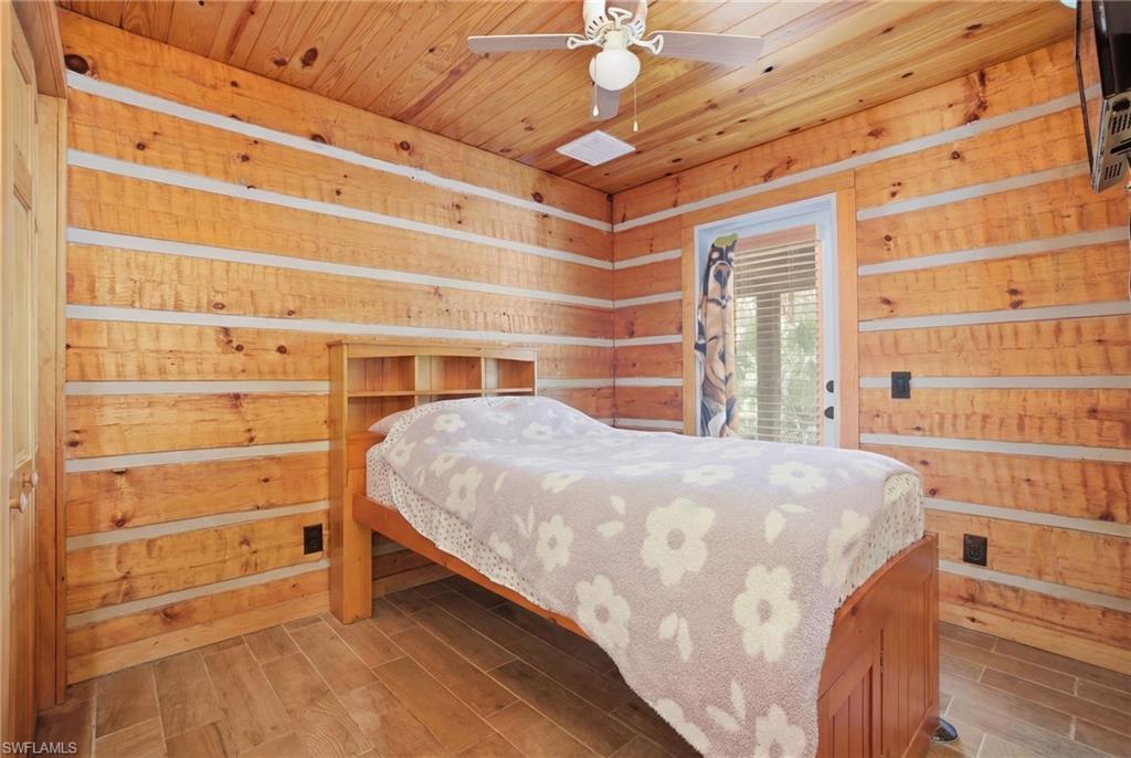 3670 27th Avenue Southwest Naples, FL 34117 - Photo 33 of 38 a bedroom with a bed and a window