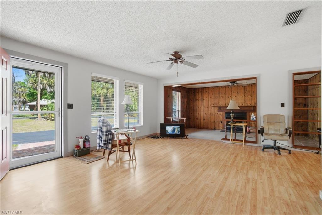 3670 27th Avenue Southwest Naples, FL 34117 - Photo 7 of 38 a view of a livingroom with workspace and a window