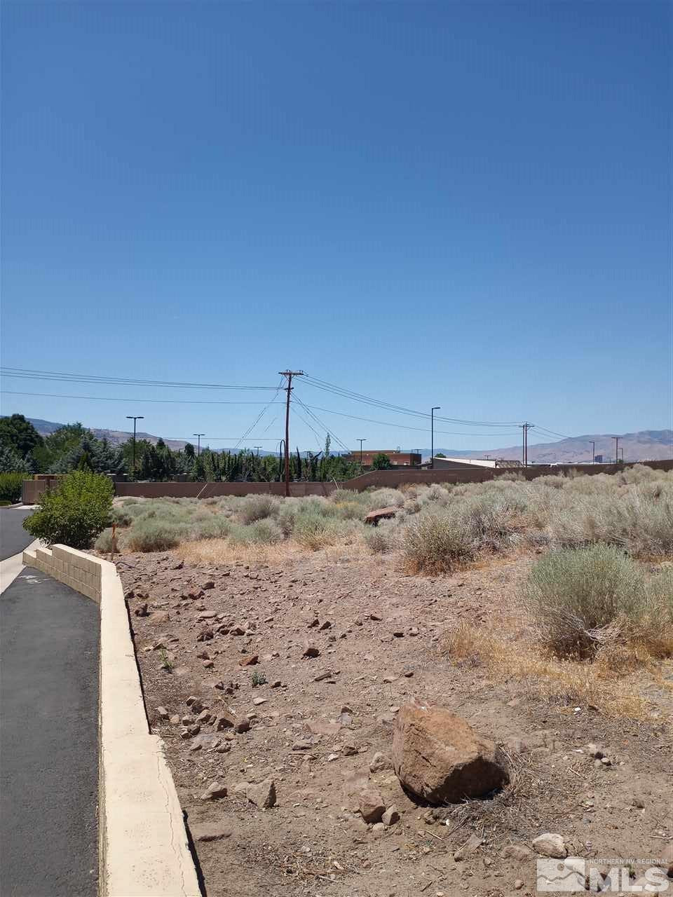 0 Desert Way Reno, NV 89502 - Photo 5 of 8 a view of a dry yard with wooden fence