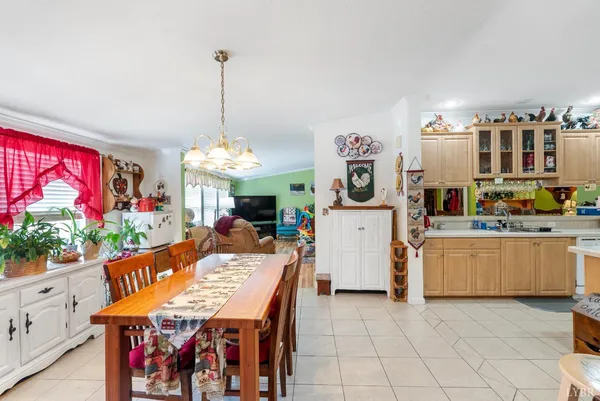 a view of a dining room with furniture window and outdoor kitchen
