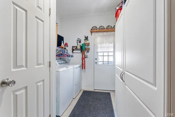 a utility room with closet dryer and washer