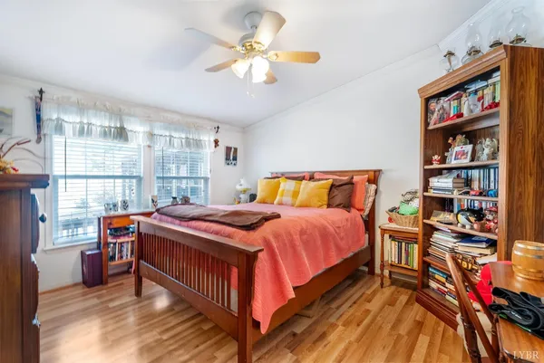 a bedroom with a bed and a book shelf