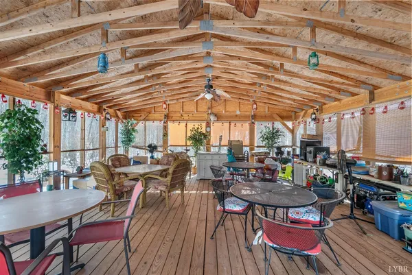 a view of a patio with table and chairs and potted plants