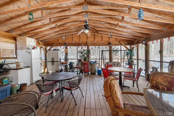 a view of a chairs and table in the patio