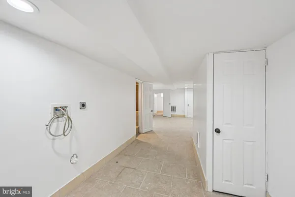 a view of a room with white walls