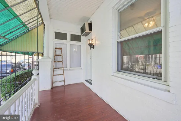 a view of an entryway with wooden floor
